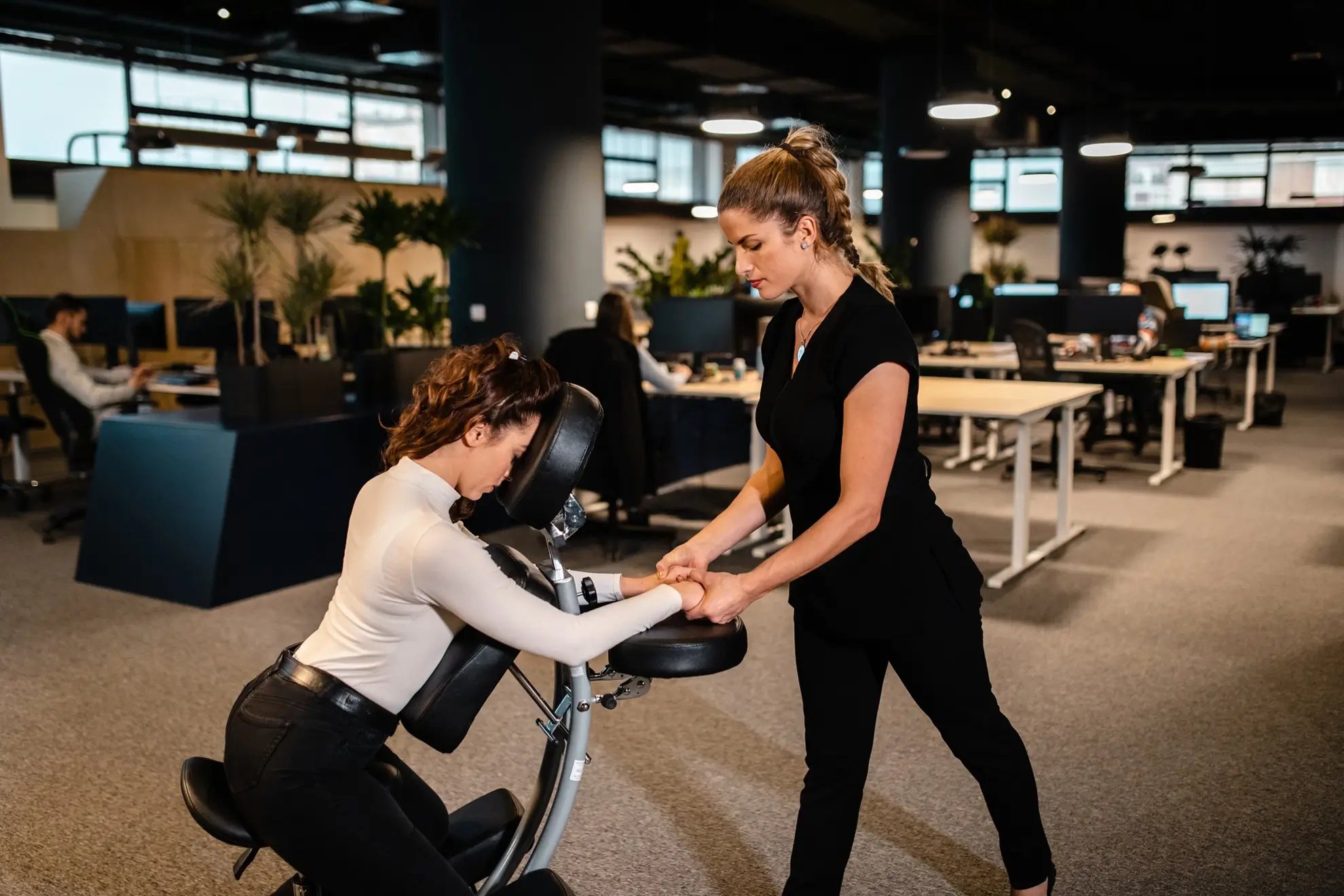 Chair massage enhancing spa parties and gatherings with friends for relaxation and well-being.